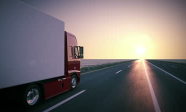 stock-footage-truck-on-the-road-with-sunset-in-the-background-large-delivery-truck-is-moving-towards-setting-sun