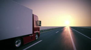 stock-footage-truck-on-the-road-with-sunset-in-the-background-large-delivery-truck-is-moving-towards-setting-sun