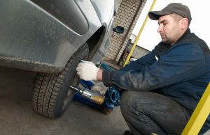 machanic repairman at tyre replacement