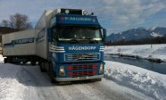 Blue-Volvo-truck-with-trailer-in-winter