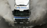 169900-lorry-in-flooded-motorway-road-illustrating-flooding-weather-rain-bad-weather-transport-cars-o