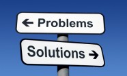 Signpost pointing to problems and solutions.