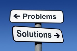 Signpost pointing to problems and solutions.