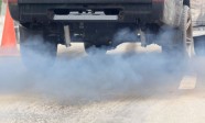 Air pollution from vehicle exhaust pipe on road