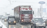 Traffic jam formed at the road caused by heavy snowstorm.