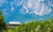 White Truck on the highway in European Alps.